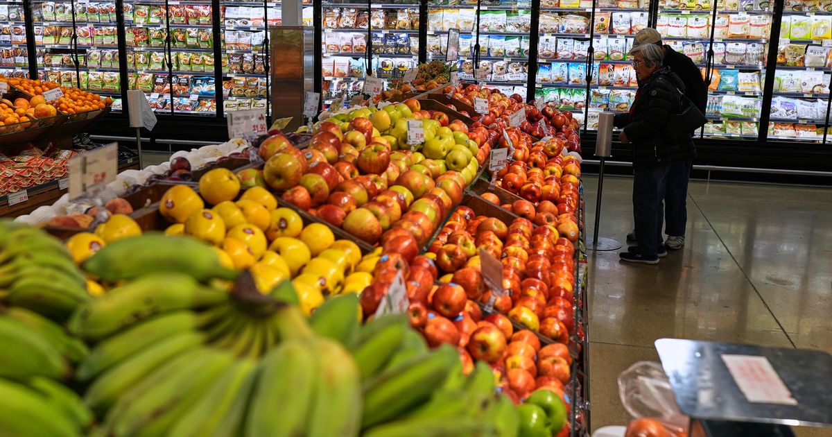 US economy grew a sluggish 0.5% in fourth quarter, government says, downgrading previous estimate