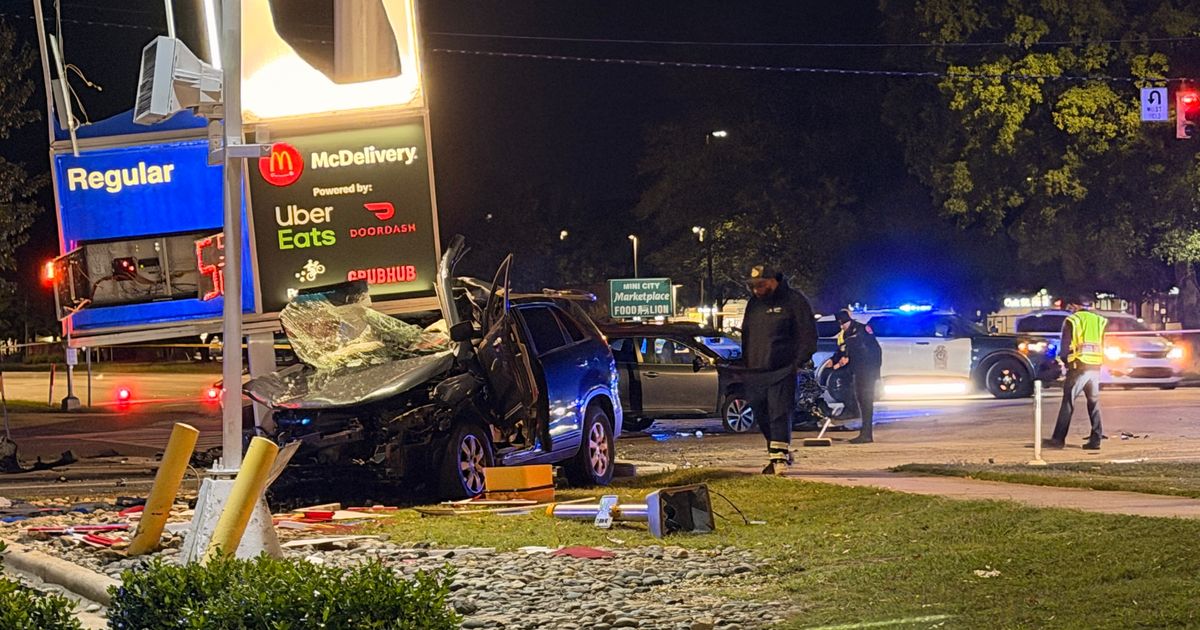 Van crashes into gas station sign after being hit on Capital Boulevard in Raleigh