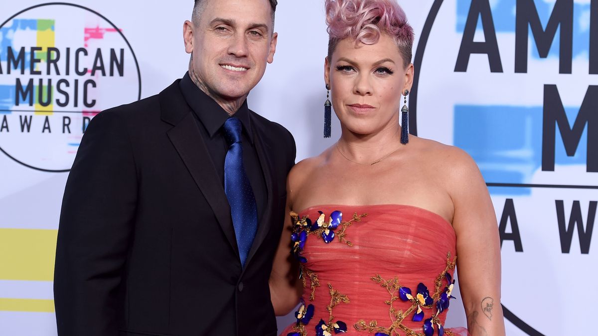 FILE - Singer Pink, right, and Carey Hart appear at the American Music Awards in Los Angeles on Nov. 19, 2017. (Photo by Jordan Strauss/Invision/AP, File)