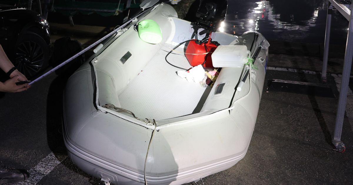 A Chinese dissident is in South Korean custody after a perilous escape by rubber boat