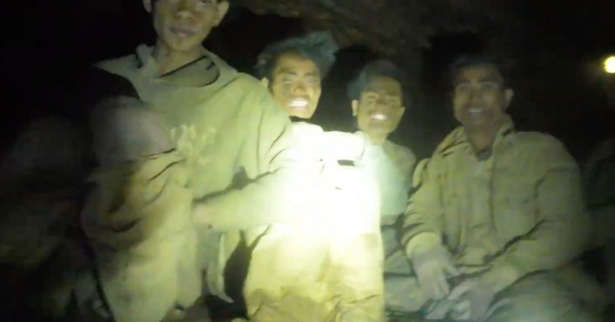 Rescuers work to drain flooded Laos cave to free 5 villagers and search for 2 still missing