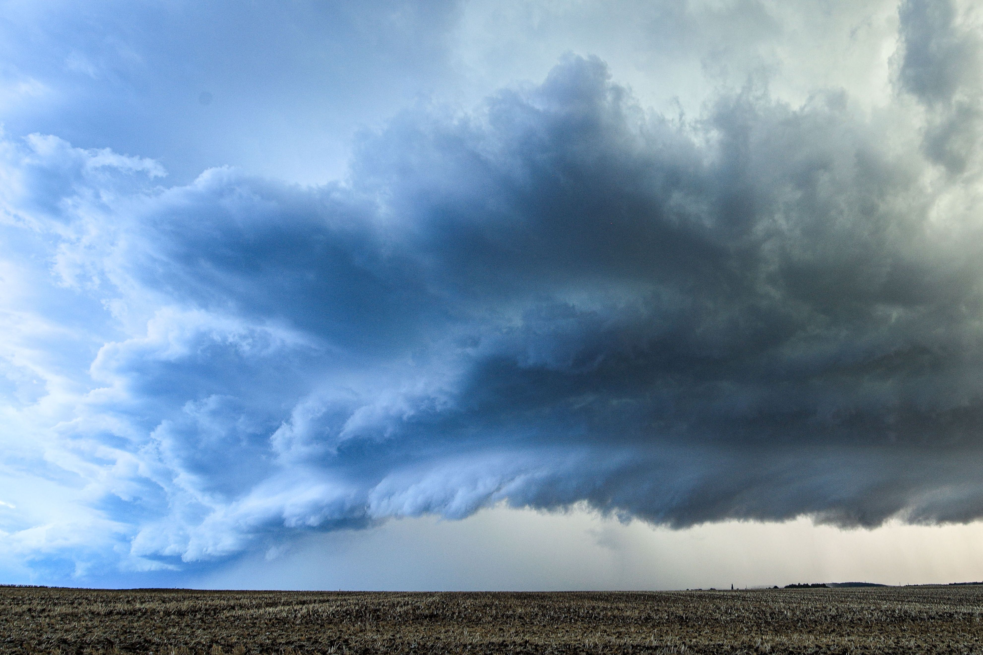 Deadly overnight storms batter Germany , killing a woman and injuring at least 2