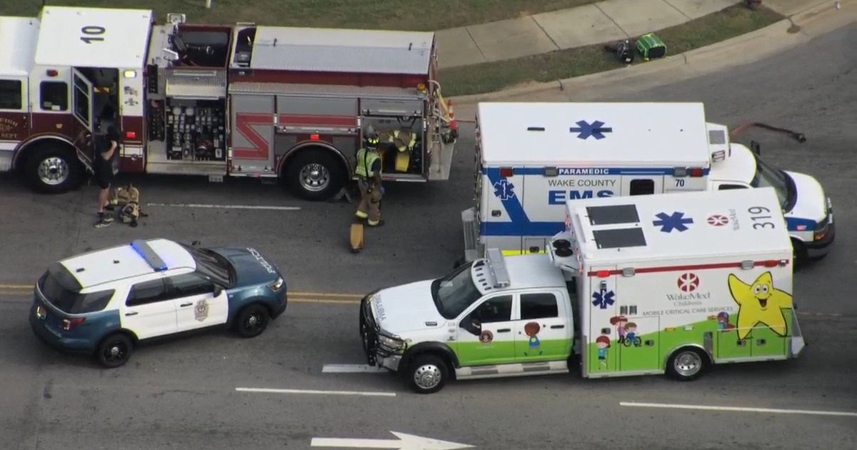 Emergency crews rescue person trapped under pickup truck at busy Raleigh intersection
