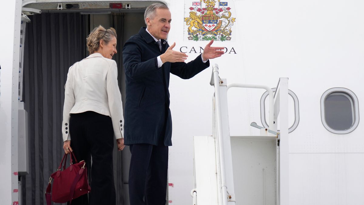 Canadian Prime Minister Mark Carney and his wife Diana Fox Carney board a government plane in Ottawa on Thursday, Feb. 26, 2026. (Adrian Wyld/The Canadian Press via AP)