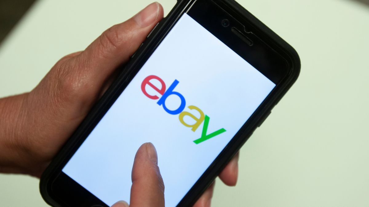 FILE - An eBay app logo is shown on a mobile phone, July 11, 2019, in Miami. (AP Photo/Wilfredo Lee, File)