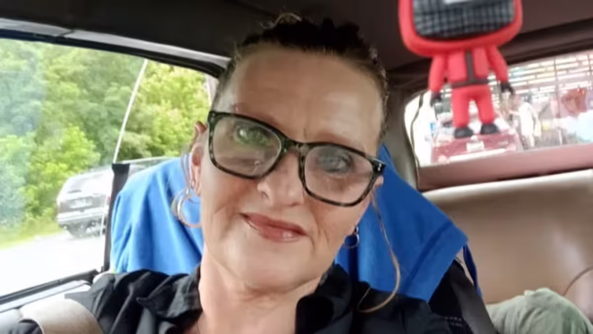 Angela Lipps being escorted by police in Tennessee