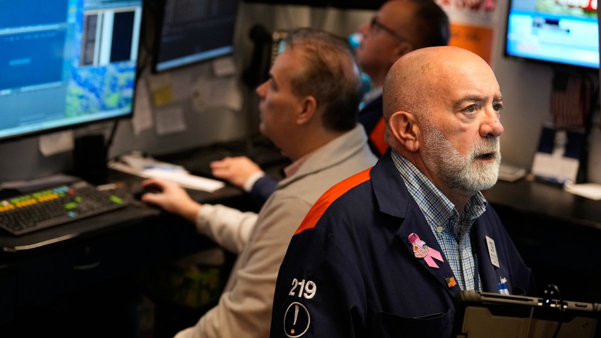 Joseph Stevens works on the floor at the New York Stock Exchange in New York, Tuesday, Jan. 6, 2026. (AP Photo/Seth Wenig)