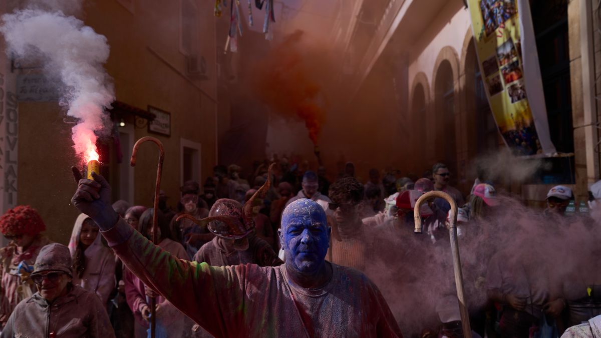 Revelers take part in the annual flour war marking the end of the Carnival season on Clean Monday in Galaxidi, about 200 kilometers (120 miles) west of Athens, Monday Feb. 23, 2026, starting the 40-day Christian Lent fast leading to Easter. (AP Photo/Petros Giannakouris)