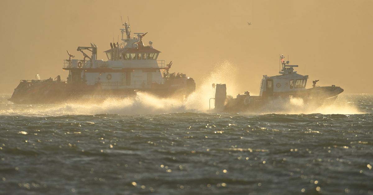Search and rescue operation for a sunken pontoon boat near Alcatraz Island, in photos