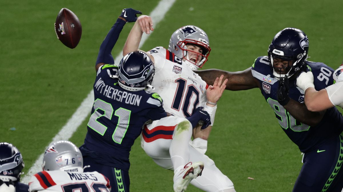 Seattle Seahawks cornerback Devon Witherspoon (21) forces a fumble against New England Patriots quarterback Drake Maye (10) at the NFL Super Bowl 60 game in Santa Clara, Calif., Sunday, February 8, 2026. (Adam Hunger/AP Content Services for the NFL)