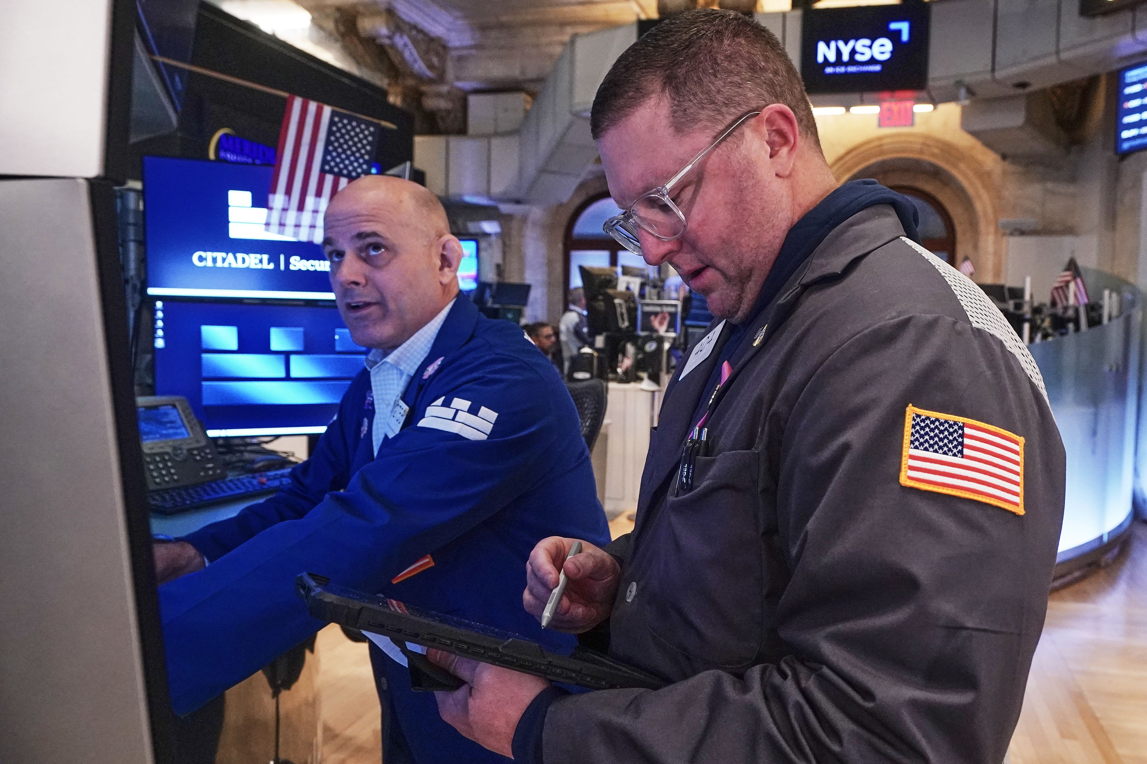 Image for Wall Street holds steady as Exxon Mobil climbs and AutoZone falls