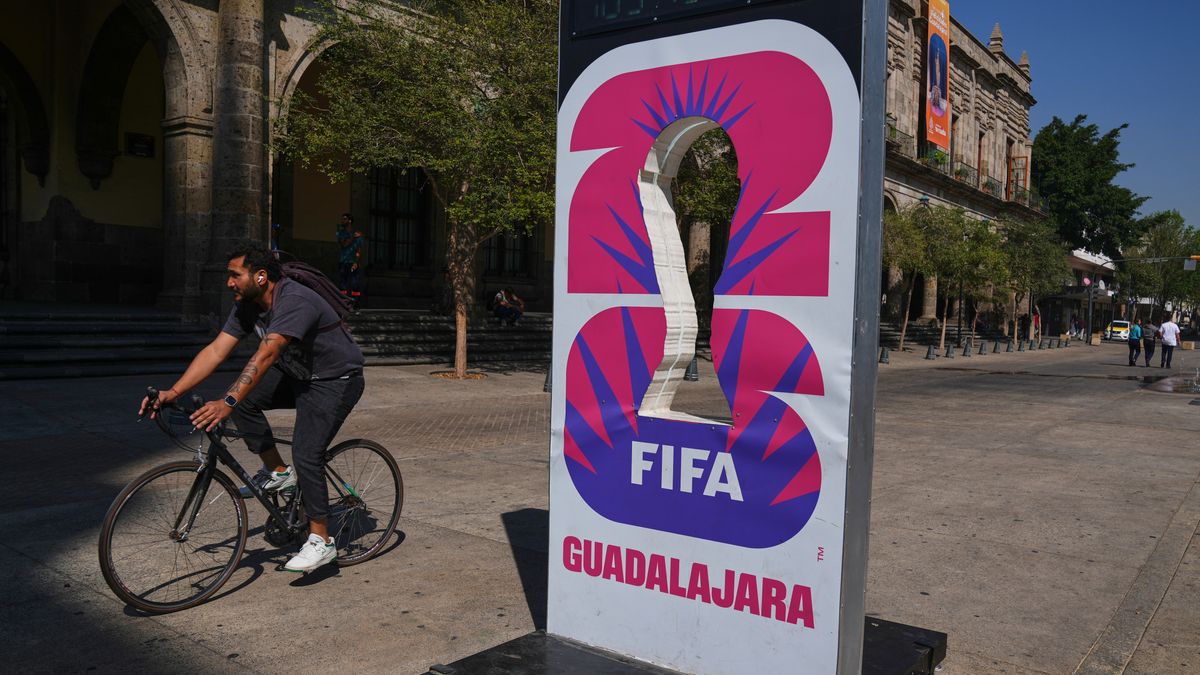 A cyclist rides past an installation promoting the FIFA World Cup 2026 in Guadalajara, Mexico, Wednesday, Feb. 25, 2026. (AP Photo/Marco Ugarte)