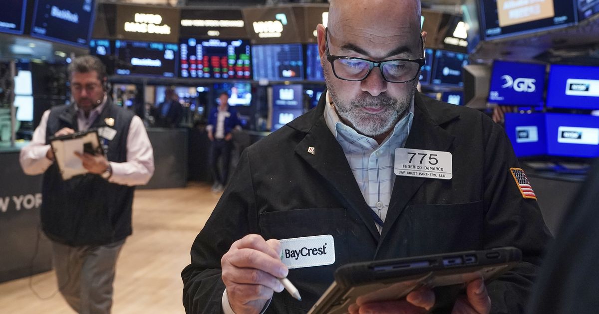 Asian shares trade higher ahead of Lunar New Year holidays and gold prices fall