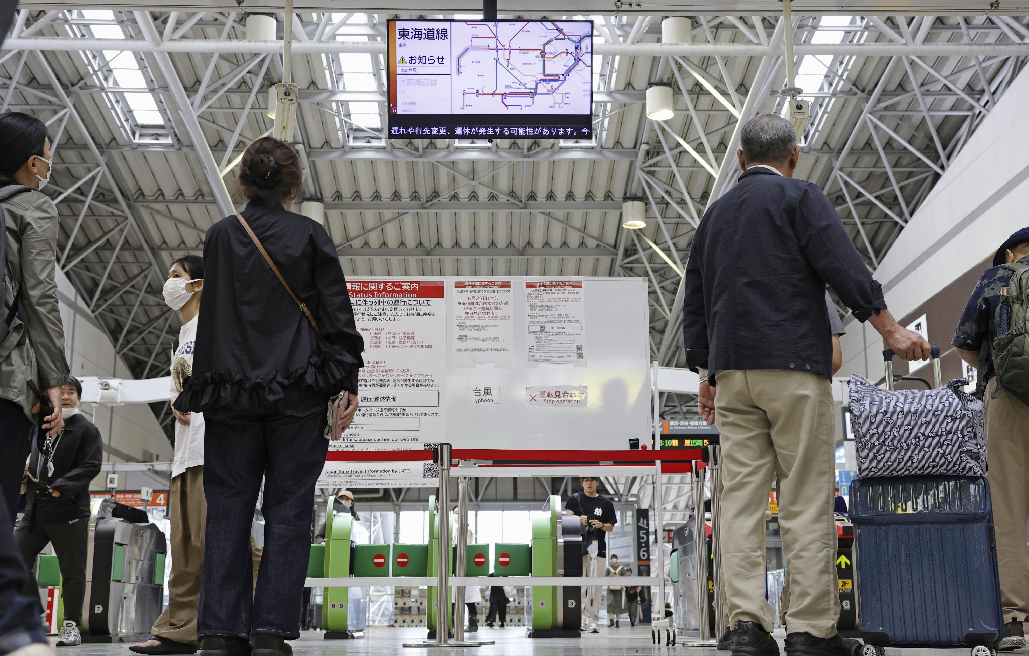 Heavy rain pounds western Japan as 2 tropical storms approach