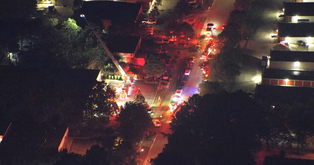Vehicles burn outside Apex business