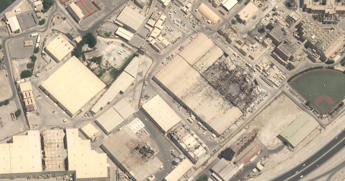 This satellite image taken over Naval Support Activity Bahrain on July 23, 2026, displaying extensive damage to the satellite communications system and warehouses. (© Airbus DS 2026 via AP)