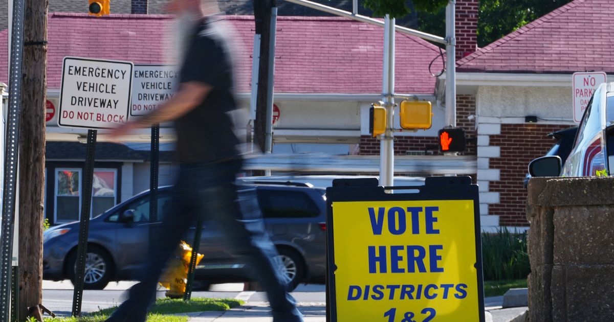 The Latest: Polls open for races across the US as a busy primary election day gets underway