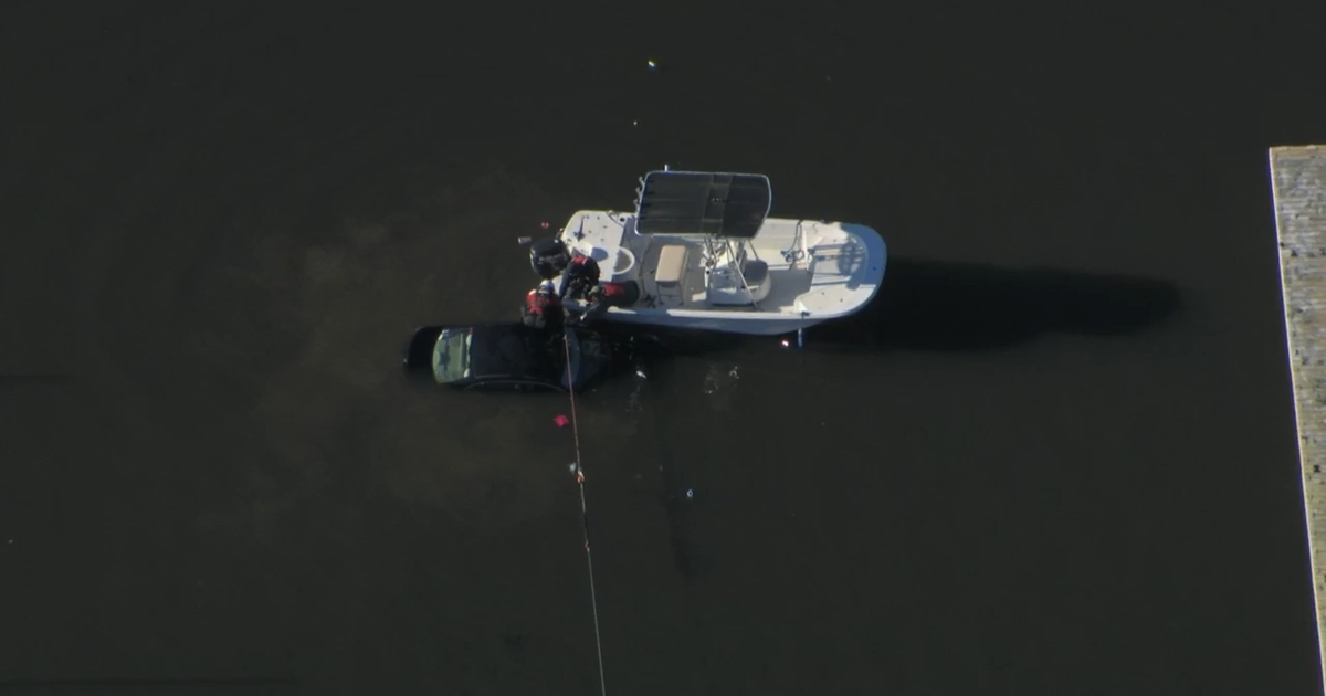 Woman pulled out of car submerged in Lake Wheeler