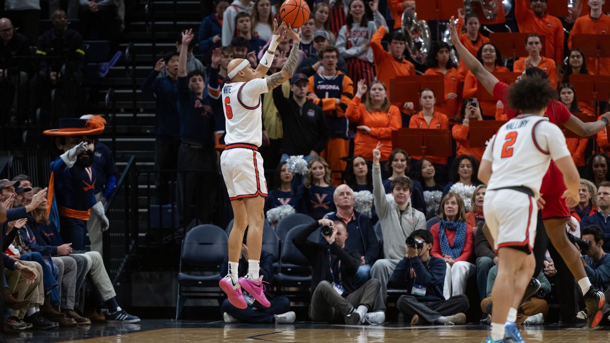 Virginia guard Jacari White (6) makes a three point shot against NC State during the first half of an NCAA college basketball game, Tuesday, Feb. 24, 2026, in Charlottesville, Va. (AP Photo/Robert Simmons)