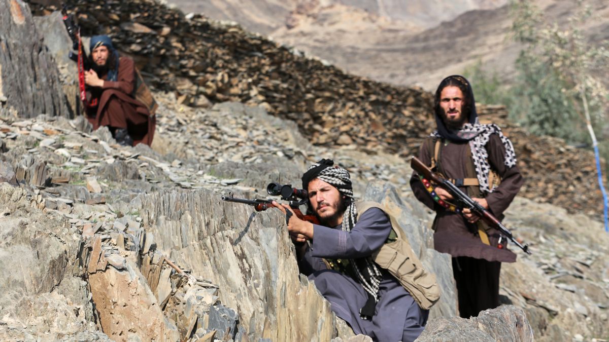 Afghan Taliban soldiers look toward the Pakistani side, with one peering through the sight of his rifle, on the Afghan side of the Torkham border crossing with Pakistan in Torkham, Afghanistan, Friday, Feb. 27, 2026. (AP Photo/Wahidullah Kakar)
