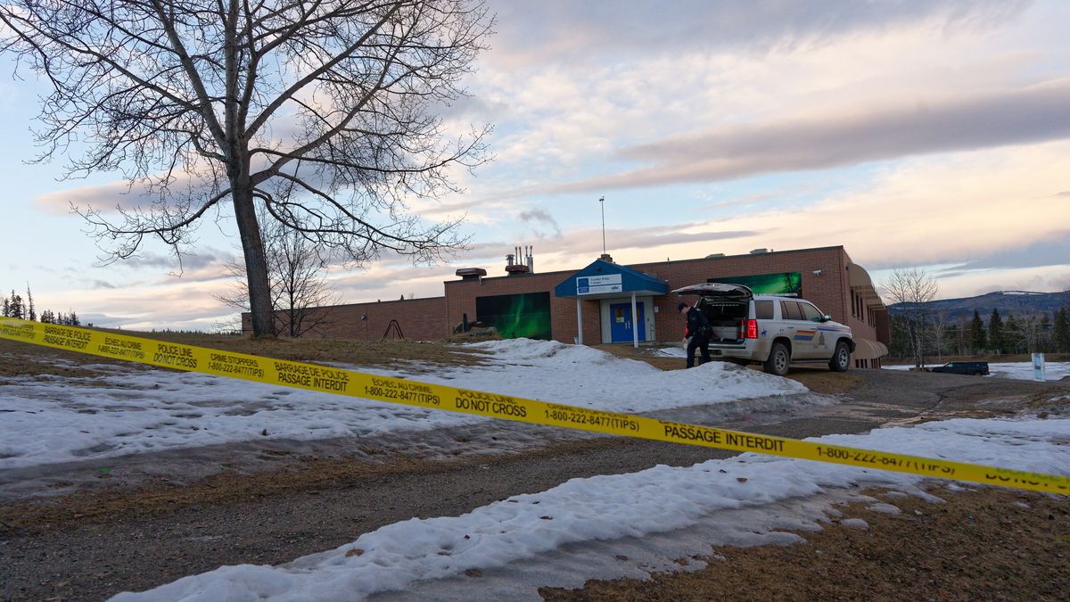 Police began putting tape out near the Tumbler Ridge Secondary School and surrounding buildings in Tumbler Ridge, B.C. on Wednesday, Feb. 11, 2026.(Jesse Boily /The Canadian Press via AP)