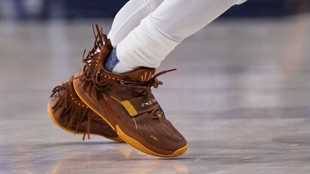 FILE - The tassels on Dallas Mavericks guard Kyrie Irving wave as he participates during the second half in Game 3 of the NBA basketball finals against the Boston Celtics, Wednesday, June 12, 2024, in Dallas. (AP Photo/Tony Gutierrez, File)