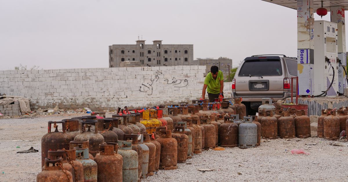 A worker prepares gas cylinders for refilling at a gas station in Mahra, Yemen, Wednesday, Sept. 9, 2026. (AP