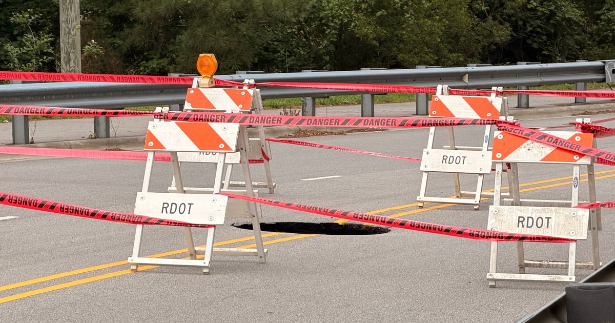 Large hole blocks traffic on Yonkers Road in Raleigh