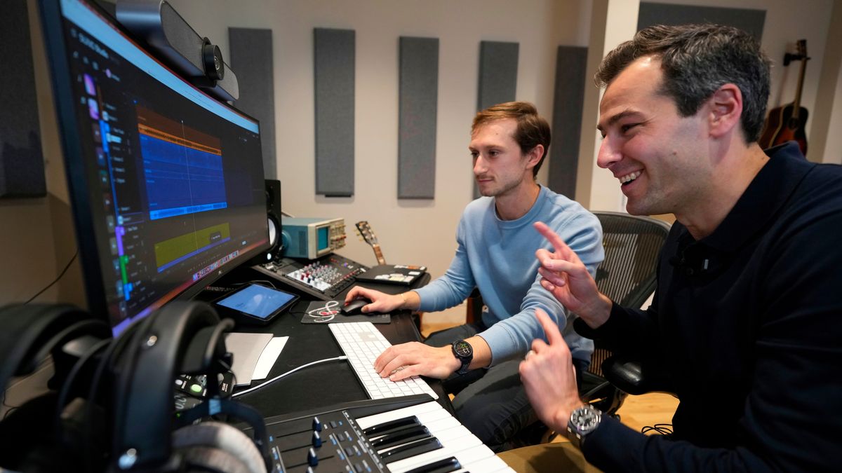 Mikey Shulman, one of the founders of AI music generator startup Suno, right, and research scientist Christian Steinmetz, collaborate on creating a song, Tuesday, Jan. 13, 2026, in Cambridge, Mass. (AP Photo/Robert F. Bukaty)