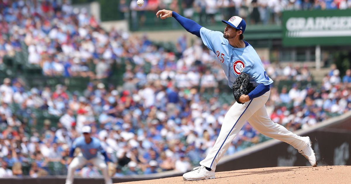 Chicago Cubs pitcher Clay Holmes delivers to a St. Louis Cardinals batter during the first inning of a baseball game in