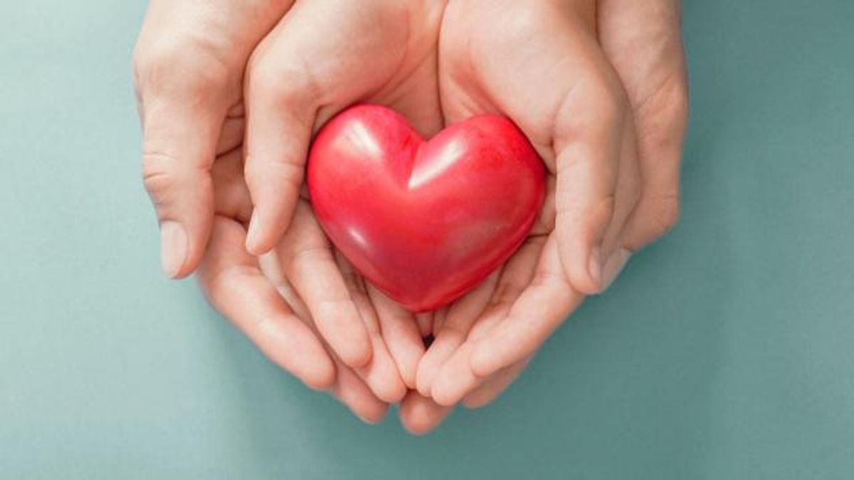 Hands holding a heart