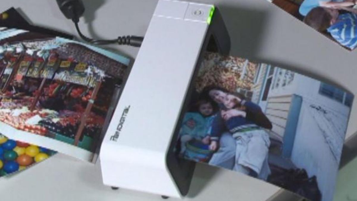 Portable photo scanners can digitize old photographs in seconds and save them to memory cards or directly onto a computer 