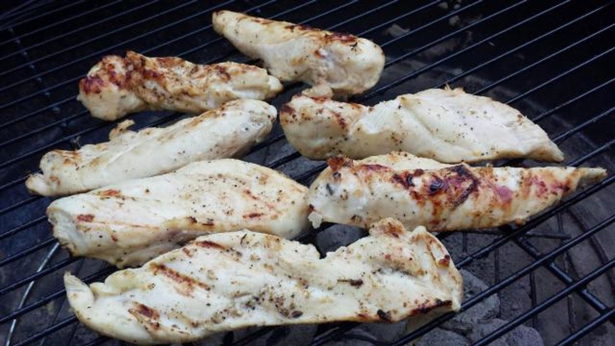 Italian chicken breast cooking on the grill