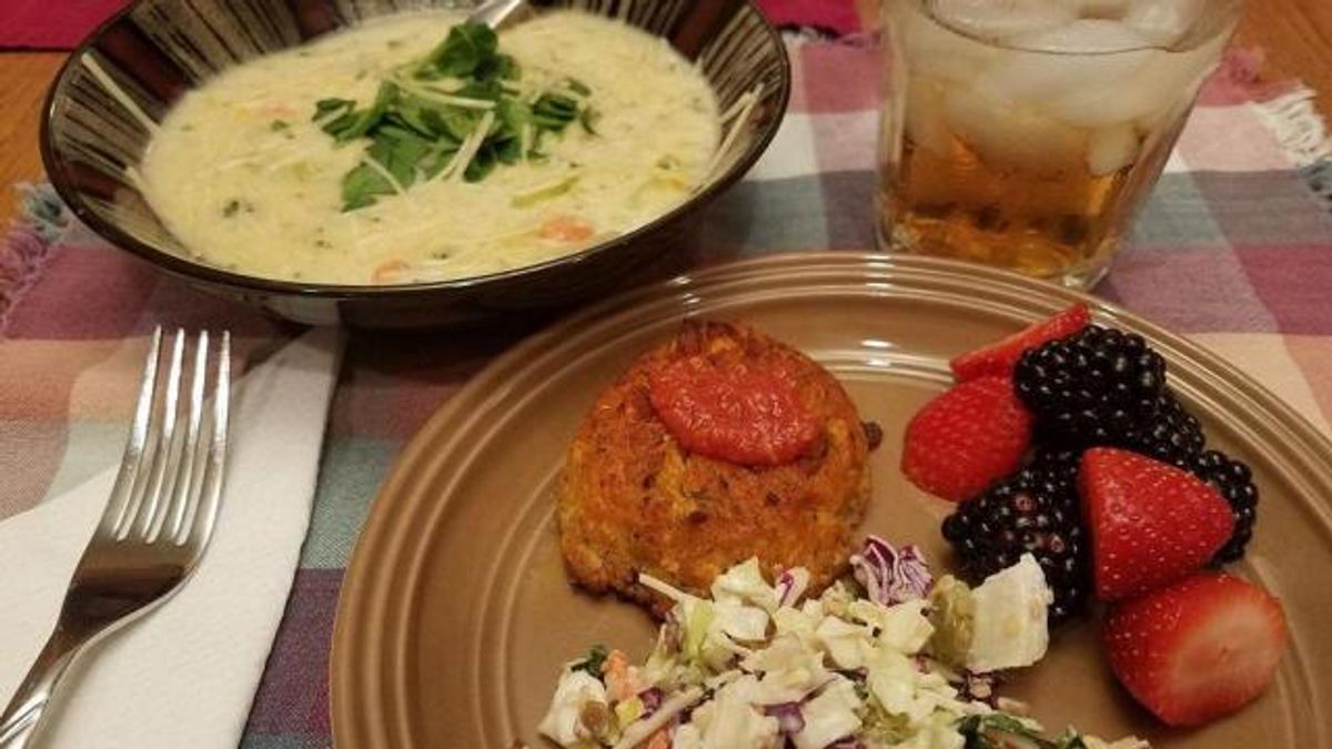 Broccoli cheddar soup, crab cake, slaw, fruit salad