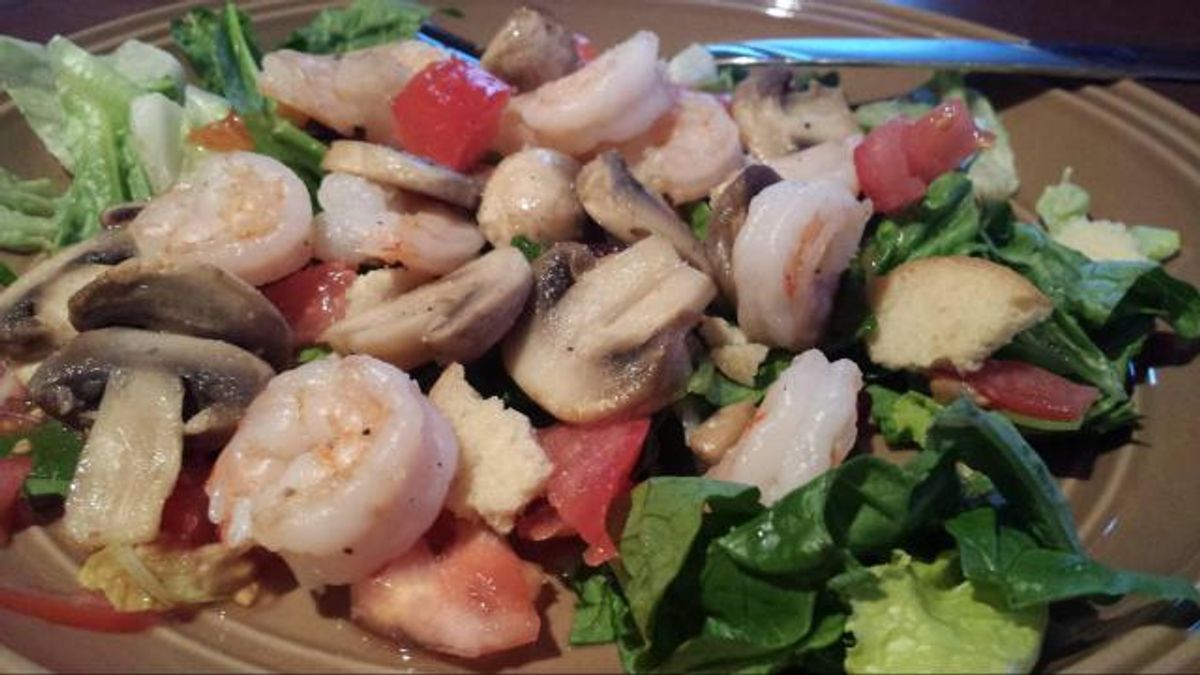 Garlic shrimp on salad