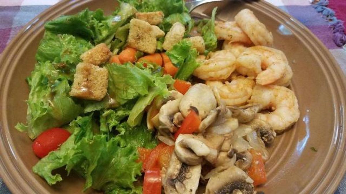 Cajun shrimp, sauteed veggies, salad