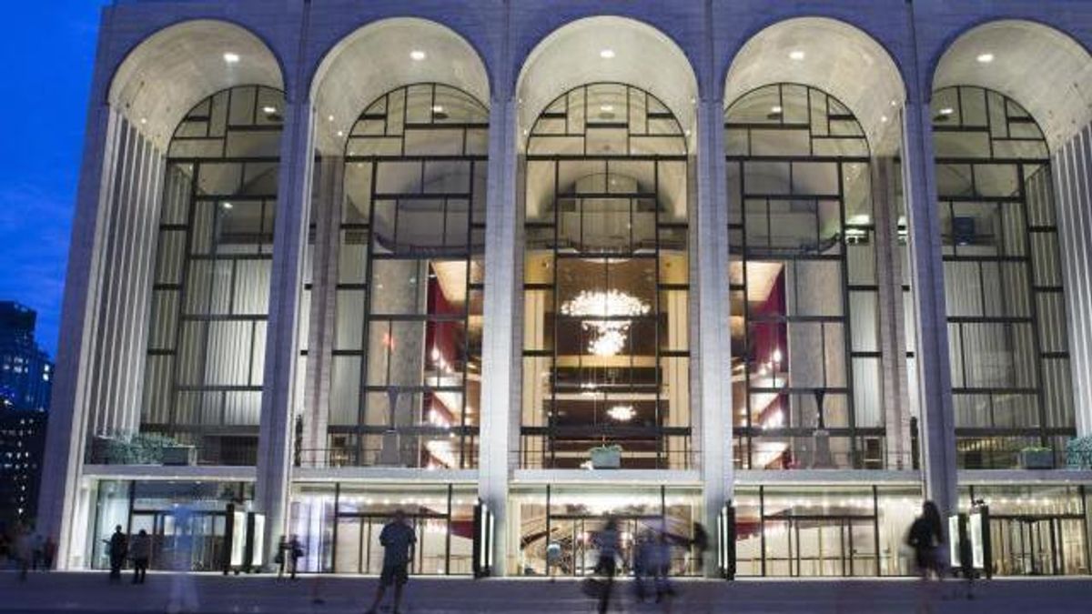 FILE - In this Aug. 1, 2014, file photo, pedestrians make their way in front of the Metropolitan Opera house at New York's Lincoln Center. (AP Poto/John Minchillo, File)