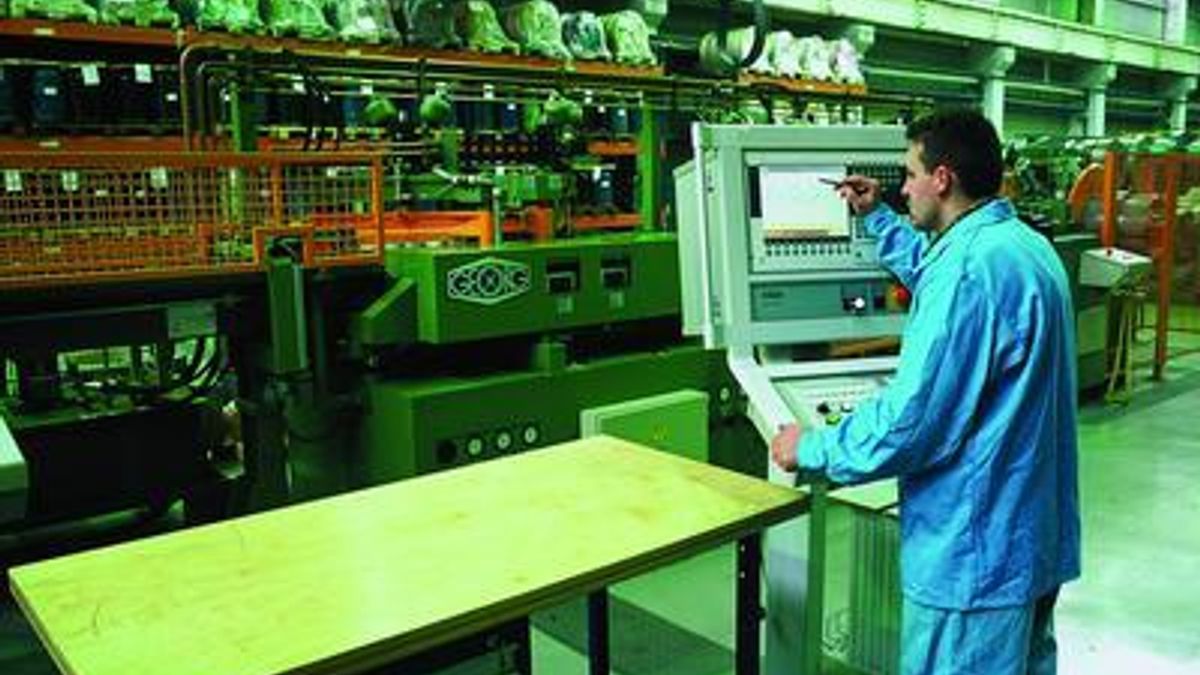 An ABB employee works on an assembly line
