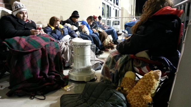 Bargain shoppers use blankets, bushes to wait for deals