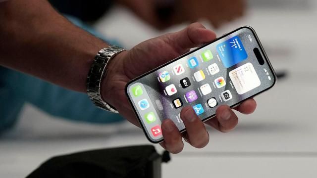 Apple shows off the new iPhone 15 Pro after its introduction on the Apple campus Tuesday in Cupertino, California. (Jeff Chiu/AP)