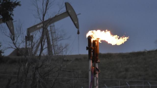 FILE - A flare to burn methane from oil production is seen on a well pad, Aug. 26, 2021, near Watford City, N.D. On Saturday, Dec. 2, 2023, the Biden administration issued a final rule aimed at reducing methane emissions, targeting the U.S. oil and natural gas industry for its role in global warming as President Joe Biden seeks to advance his climate legacy. (AP Photo/Matthew Brown, File)