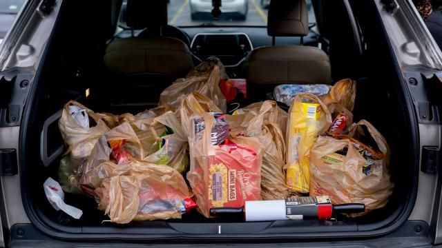 FILE — Groceries in the trunk of a car after a purchase at a Kroger Marketplace in Royal Oak, Mich., on Nov. 17, 2021. President Biden, whose approval rating has suffered amid high inflation, is beginning to pressure large grocery chains to slash food prices for American consumers, accusing them of reaping excess profits and ripping off shoppers. (Brittany Greeson/The New York Times)
