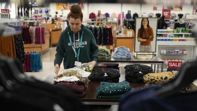 An employee straightens displays at a Kohl's store in Clifton, N.J., Friday, Jan. 26, 2024. A year ago, the store had tables stacked high with sweaters and shirts in a rainbow of colors as well as dress racks crammed with a wide assortment of styles. Now, it boasts a more edited approach — tables have slim piles of knit shirts that focus on fewer colors, and many dress racks have been reduced to just three or four styles. (AP Photo/Seth Wenig) An employee straightens displays at a Kohl's store in Clifton, N.J., Friday, Jan. 26, 2024. A year ago, the store had tables stacked high with sweaters and shirts in a rainbow of colors as well as dress racks crammed with a wide assortment of styles. Now, it boasts a more edited approach — tables have slim piles of knit shirts that focus on fewer colors, and many dress racks have been reduced to just three or four styles. (AP Photo/Seth Wenig)