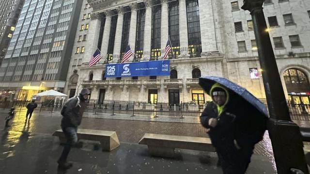 File - Pedestrians pass the New York Stock Exchange as snow falls on Tuesday, Feb. 13, 2024 in New York. (AP Photo/Peter Morgan, File) File - Pedestrians pass the New York Stock Exchange as snow falls on Tuesday, Feb. 13, 2024 in New York. (AP Photo/Peter Morgan, File)