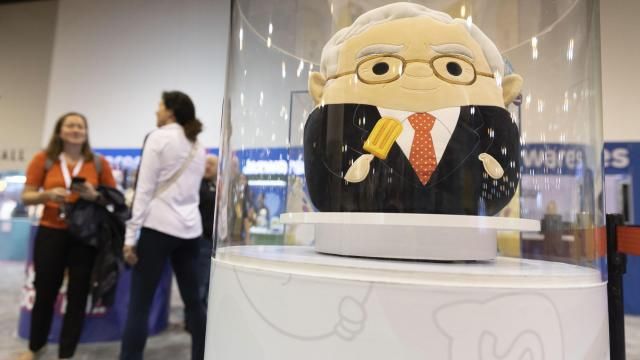 FILE - The Squishmallows booth sells toys modeled after Warren Buffett, pictured, and Charlie Munger in the exhibit hall for the Berkshire Hathaway annual meeting, Saturday, May 6, 2023, in Omaha, Neb. In a lawsuit filed Monday, Feb. 12, 2024, Kelly Toys and parent company Jazwares accused Build-A-Bear's new “Skoosherz” line of copying Squishmallows' look and feel. Skoosherz toys have the “same distinctive trade dress” of Squishmallows, the complaint said — pointing to shape, face style, coloring and fabric similarities. (AP Photo/Rebecca S. Gratz, File) FILE - The Squishmallows booth sells toys modeled after Warren Buffett, pictured, and Charlie Munger in the exhibit hall for the Berkshire Hathaway annual meeting, Saturday, May 6, 2023, in Omaha, Neb. In a lawsuit filed Monday, Feb. 12, 2024, Kelly Toys and parent company Jazwares accused Build-A-Bear's new “Skoosherz” line of copying Squishmallows' look and feel. Skoosherz toys have the “same distinctive trade dress” of Squishmallows, the complaint said — pointing to shape, face style, coloring and fabric similarities. (AP Photo/Rebecca S. Gratz, File)