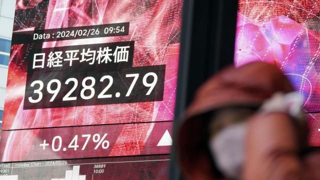 A person walks in front of an electronic stock board showing Japan's Nikkei 225 index at a securities firm Monday, Feb. 26, 2024, in Tokyo. Asian shares mostly declined Monday, although Tokyo's benchmark Nikkei 225 index touched another record high in morning trading. (AP Photo/Eugene Hoshiko) A person walks in front of an electronic stock board showing Japan's Nikkei 225 index at a securities firm Monday, Feb. 26, 2024, in Tokyo. Asian shares mostly declined Monday, although Tokyo's benchmark Nikkei 225 index touched another record high in morning trading. (AP Photo/Eugene Hoshiko)