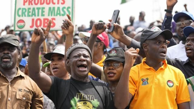 Labour unionist march on the streets to protest economic hardship in Lagos Nigeria, Tuesday, Feb. 27, 2024. Nigerian government workers began a new nationwide strike Tuesday, that threatens to shut down key services across the country. Protestors are angry at the growing economic hardship with talks late Monday night breaking down to avert the walkout. (AP Photo/Sunday Alamba) Labour unionist march on the streets to protest economic hardship in Lagos Nigeria, Tuesday, Feb. 27, 2024. Nigerian government workers began a new nationwide strike Tuesday, that threatens to shut down key services across the country. Protestors are angry at the growing economic hardship with talks late Monday night breaking down to avert the walkout. (AP Photo/Sunday Alamba)