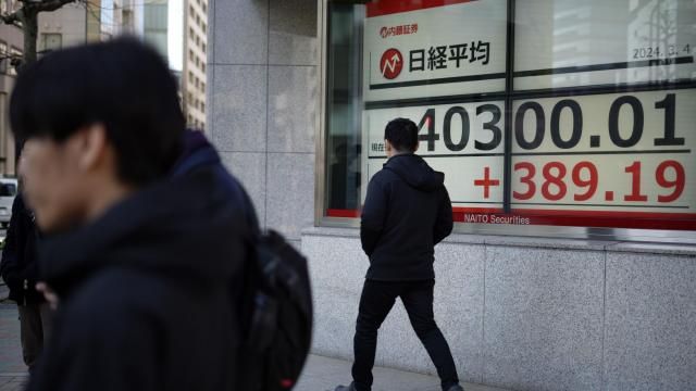 A person walks in front of an electronic stock board showing Japan's Nikkei 225 index at a securities firm Monday, March 4, 2024, in Tokyo. Japan's Nikkei 225 share benchmark has topped 40,000 for the first time as strong demand for technology shares keeps pushing the index higher.(AP Photo/Eugene Hoshiko) A person walks in front of an electronic stock board showing Japan's Nikkei 225 index at a securities firm Monday, March 4, 2024, in Tokyo. Japan's Nikkei 225 share benchmark has topped 40,000 for the first time as strong demand for technology shares keeps pushing the index higher.(AP Photo/Eugene Hoshiko)