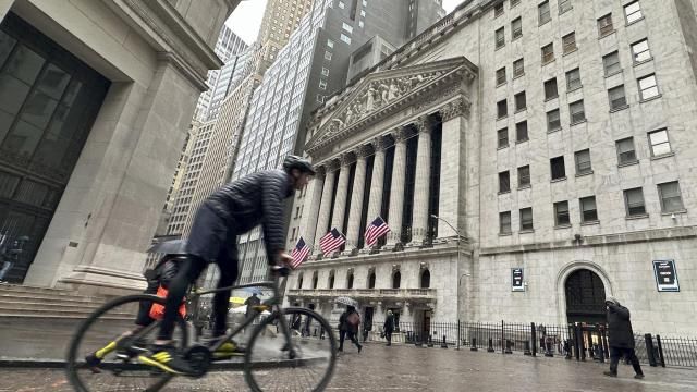A bicyclist passes the New York Stock Exchange on Tuesday, March 5, 2024, in New York. Wall Street pointed modestly lower as more retailers post results from the holiday season and ahead of appearance by Federal Reserve Chair Jerome Powell before Congress later this week. (AP Photo/Peter Morgan) A bicyclist passes the New York Stock Exchange on Tuesday, March 5, 2024, in New York. Wall Street pointed modestly lower as more retailers post results from the holiday season and ahead of appearance by Federal Reserve Chair Jerome Powell before Congress later this week. (AP Photo/Peter Morgan)
