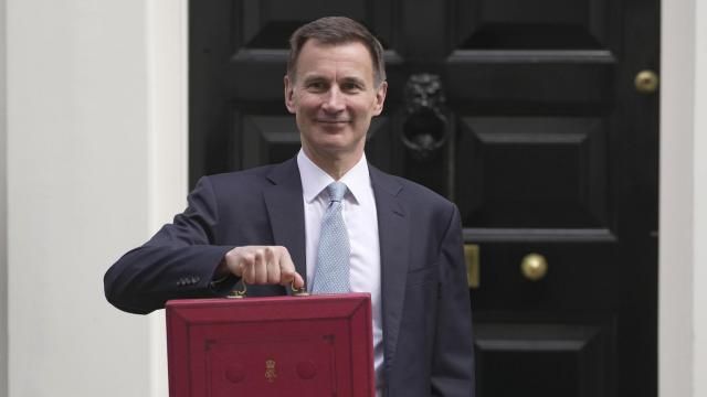 Britain's Chancellor of the Exchequer Jeremy Hunt holds his traditional red ministerial box as he leaves 11 Downing Street for the House of Commons to deliver the Budget in London, Wednesday, March 6, 2024. (AP Photo/Kin Cheung) Britain's Chancellor of the Exchequer Jeremy Hunt holds his traditional red ministerial box as he leaves 11 Downing Street for the House of Commons to deliver the Budget in London, Wednesday, March 6, 2024. (AP Photo/Kin Cheung)